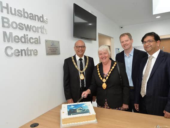 Cutting the cake to launch the new medical centre. Photos by Andy Carpenter