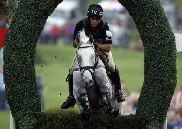 New Zealand's Andrew Nicholson riding Avebury competes in the cross-country phase during day three of the 2014 Land Rover Burghley Horse Trials a: Steve Parsons/PA Wire