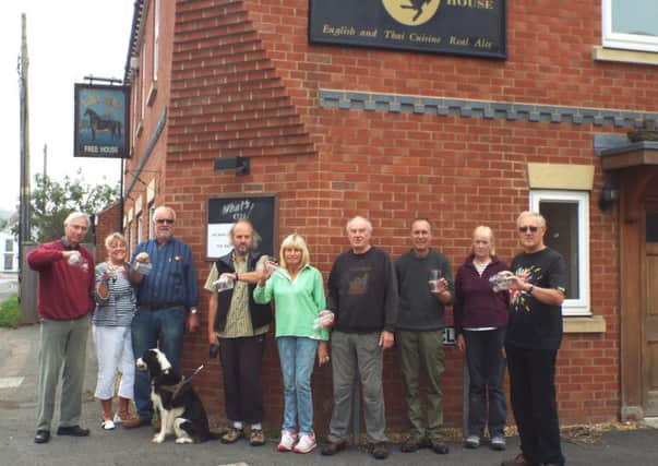 Campaigners in Walcote are being left high and dry in their battle to bring The Black Horse pub back to the village. Pat Piggott, vice-chairman of the Black Horse Community Group, is pictured second from the right