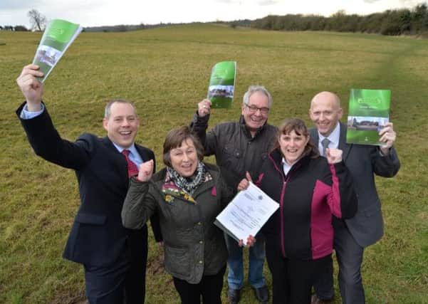 Councillor Mark Graves, Christine Lord, Alan Rowe, Debbie Barber parish manager and councillor Richard Tomlin celebrate the good news in Broughton Astley
