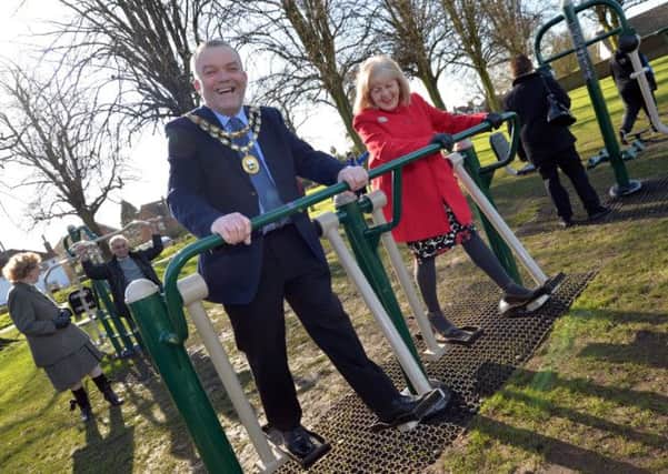 Lutterworth Mayor Cllr Philip Toye with town and district councillor Geraldine Robinson trying out the new gym equipment at Lutterworth's Recreation Ground in Coventry Road