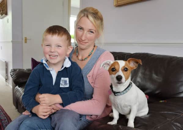 Laura Barber-Riley with son Henry (5) and pet dog Daisy at their home in Lutterworth.  (PICTURE: ANDREW CARPENTER)