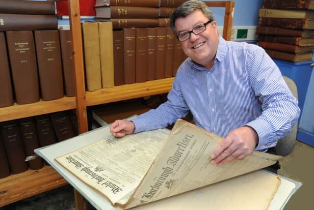 Ex Harborough Mail editor John Dilley with a copy of the 1914 Market Harborough Advertiser. 
(MAIL PICTURE: ANDREW CARPENTER/MHMP001664-20)