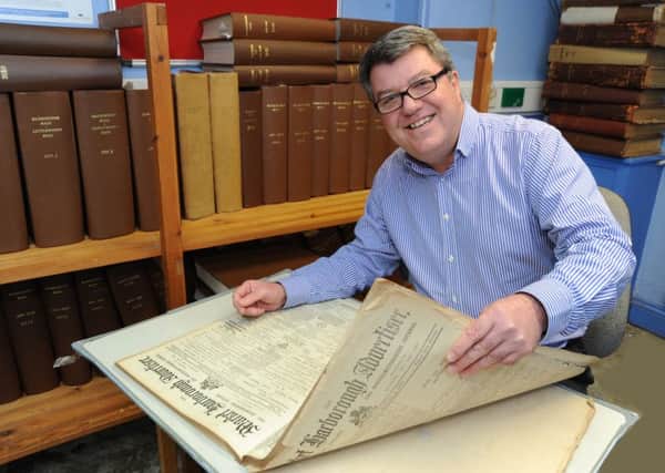 Ex Harborough Mail editor John Dilley with a copy of the 1914 Market Harborough Advertiser. 
(MAIL PICTURE: ANDREW CARPENTER/MHMP001664-20) ENGNNL00120140121183111