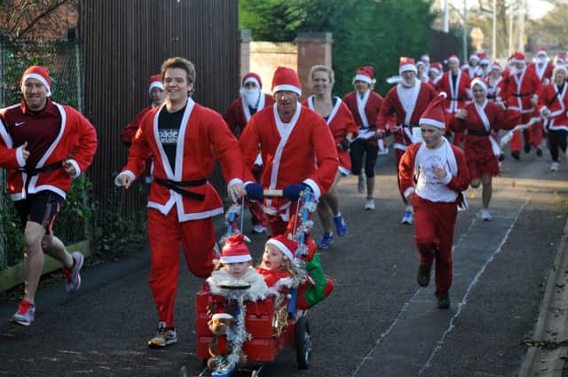 Runners set off during the Santa fun run in Lutterworth last year. (Picture: Andrew Carpenter/001389-94) ENGNNL00120111128080705