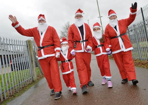 Stepping out...Steven Jesson, Grace Jesson 6, Robert Jesson, Lily Jesson 10 and Jean Jesson before the Santa run in Lutterworth.
PICTURE: ANDREW CARPENTER