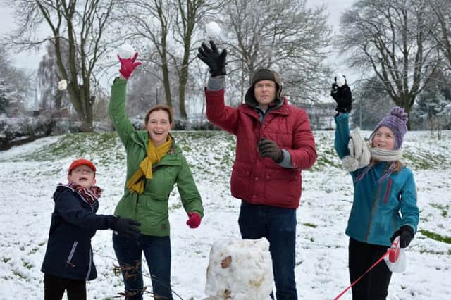 Snowball frenzy...Paul Gibbison 8, Francoise Gibbison, Robert Gibbison and Laura Gibbison 10 in Market Harborough.PICTURE: ANDREW CARPENTER NNL-160118-123858001