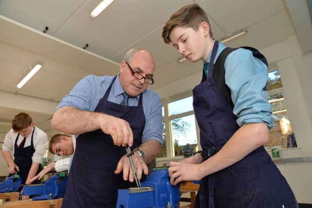 John Redmond working with students.
PICTURE: ANDREW CARPENTER