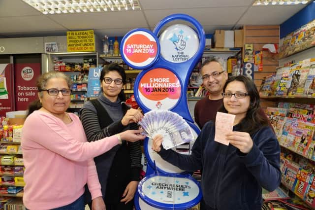 Staff at the Connaught Road post office in Market Harborough were given Â£1,000 after a lottery winner won Â£75,000 at the store. Pictured are Bhavna Pabari, Parul Chauhan, Vipul Pabari and Rupal Pabari.
PICTURE: ANDREW CARPENTER