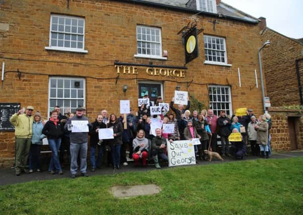 Villagers protesting outside The George pub in Ashley