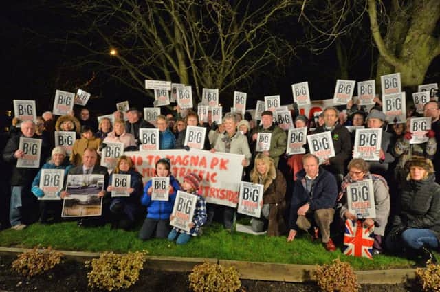 Protesters before the meeting outside Lutterworth High school.
PICTURE: ANDREW CARPENTER