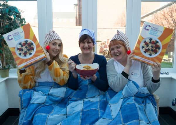 Jayne Sullivan (centre), stages a charity breakfast in bed with colleagues Annie Mitchell and Paula Scaife