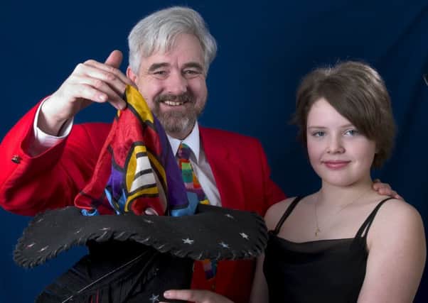 Award-winning magician Jimmy James with his daughter, and helper, Bronya