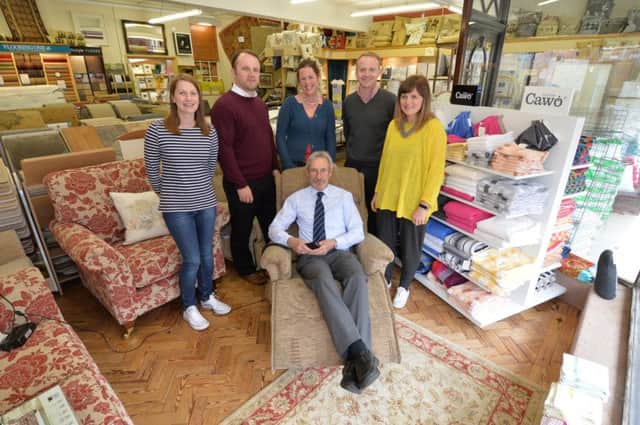Centre, Roy Carter puts his feet up after 50 years working at H Monk & Sons with some of the staff Sonia Chambers, Jeremy West, Vicky Jeffery, Ollie Monk and Kelly Monk.
PICTURE: ANDREW CARPENTER
