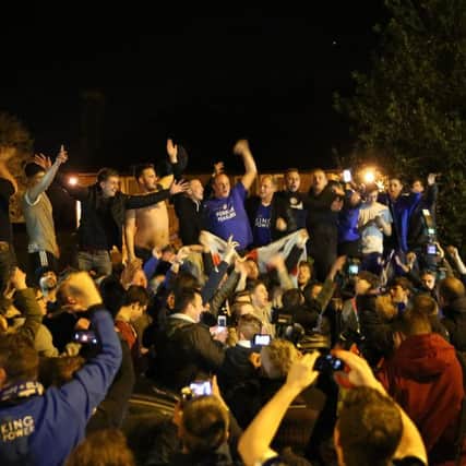 Crowds celebrate outside the home of Jamie Vardy after Leicester City win the Premier League. Pictures via SNWS