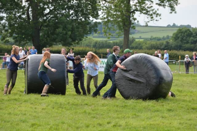 Fun during the bale rolling event.
PICTURE: ANDREW CARPENTER