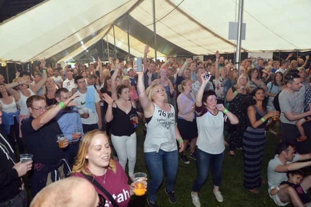 Crowds flock to the Fake Festival on Symington's Rec.
PICTURE: ANDREW CARPENTER