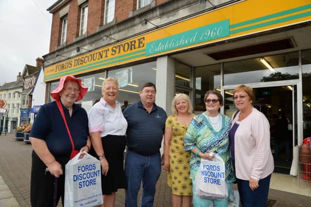 Sad day...owners Linda and Rob Ford on their last day with from left, Sue Smith, Geraldine Robinson Lutterworth mayor, Liz Lynch and Carole Harrington outside Fords Discount Store after 56 years of trading in Lutterworth.
PICTURE: ANDREW CARPENTER
