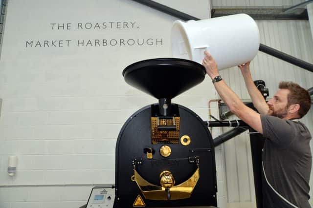 Jay Vye head of coffee puts the coffee beans into the roastery for blending at Caffe Carrara in Market Harborough.
PICTURE: ANDREW CARPENTER NNL-160926-102712005
