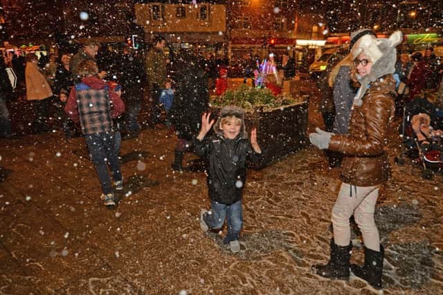 Fun in the snow during the Market Harborough Christmas Fayre in 2014. (MAIL PICTURE: ANDREW CARPENTER) NNL-140812-134546001