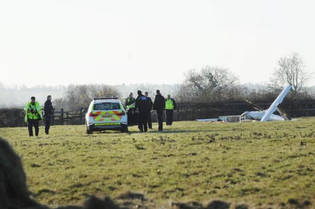 Police officers at the scene of the fatal glider crash near the Laughton Road, Lubenham. NNL-160412-151352005