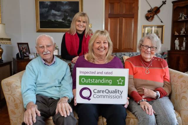 Gail Devereux-Batchelor, MD of Home Instead Senior Care in Market Harborough (back) with clients (on the sofa) and caregiver in the centre.