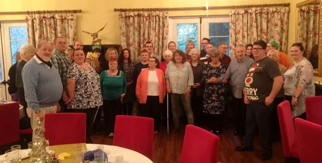 Some of the  brain injury sufferers and their carers who attended the festive lunch at the Dower House Hotel.