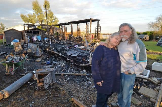 Devastated...Susan and Billy Wild beside their burnt out mobile home in Welham.
PICTURE: ANDREW CARPENTER NNL-170802-091921005