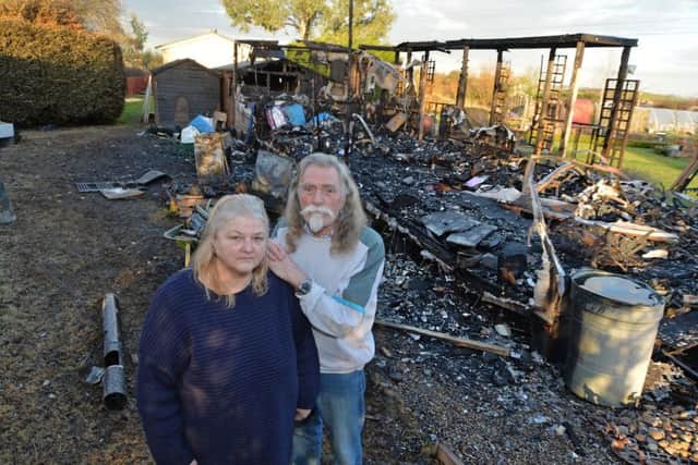 Devastated...Susan and Billy Wild beside their burnt out mobile home in Welham.
PICTURE: ANDREW CARPENTER NNL-170802-091856005