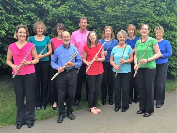 Adult flute choir performing at the church