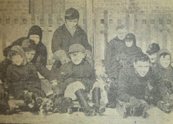 Children in Wartnaby Street in Market Harborough prepare to race down the street on their sledges