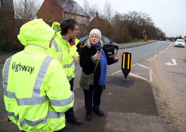 Pedestrian Cross: Desborough: resident Marianne Lendrum who uses buses meets with highways officials to discuss getting a safe crossing to the bus stop in Harborough Road. 
Marianne with Mathew Barber (Northamptonshire Highways)
Tuesday February 28 2017 NNL-170228-195812009