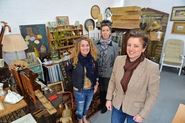 Front, owner Timmy Makra with Kathleen Kettle and Sally McDonald at the Market Harborough Antiques Centre on St Mary's Road.
PICTURE: ANDREW CARPENTER