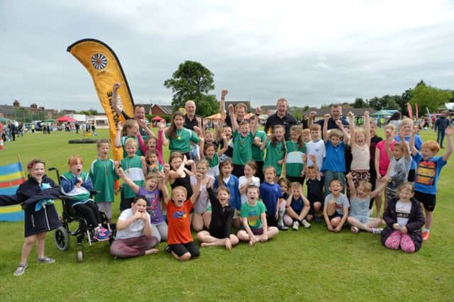 Meadowdale school celebrate winning the Roundtable It's A Knockout with runner's up Little Bowden and Foxton.
PICTURE: ANDREW CARPENTER