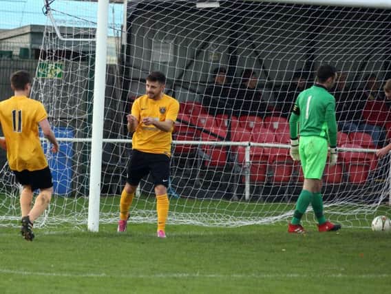 Action from Harborough Town's win over Wellingborough Whitworth